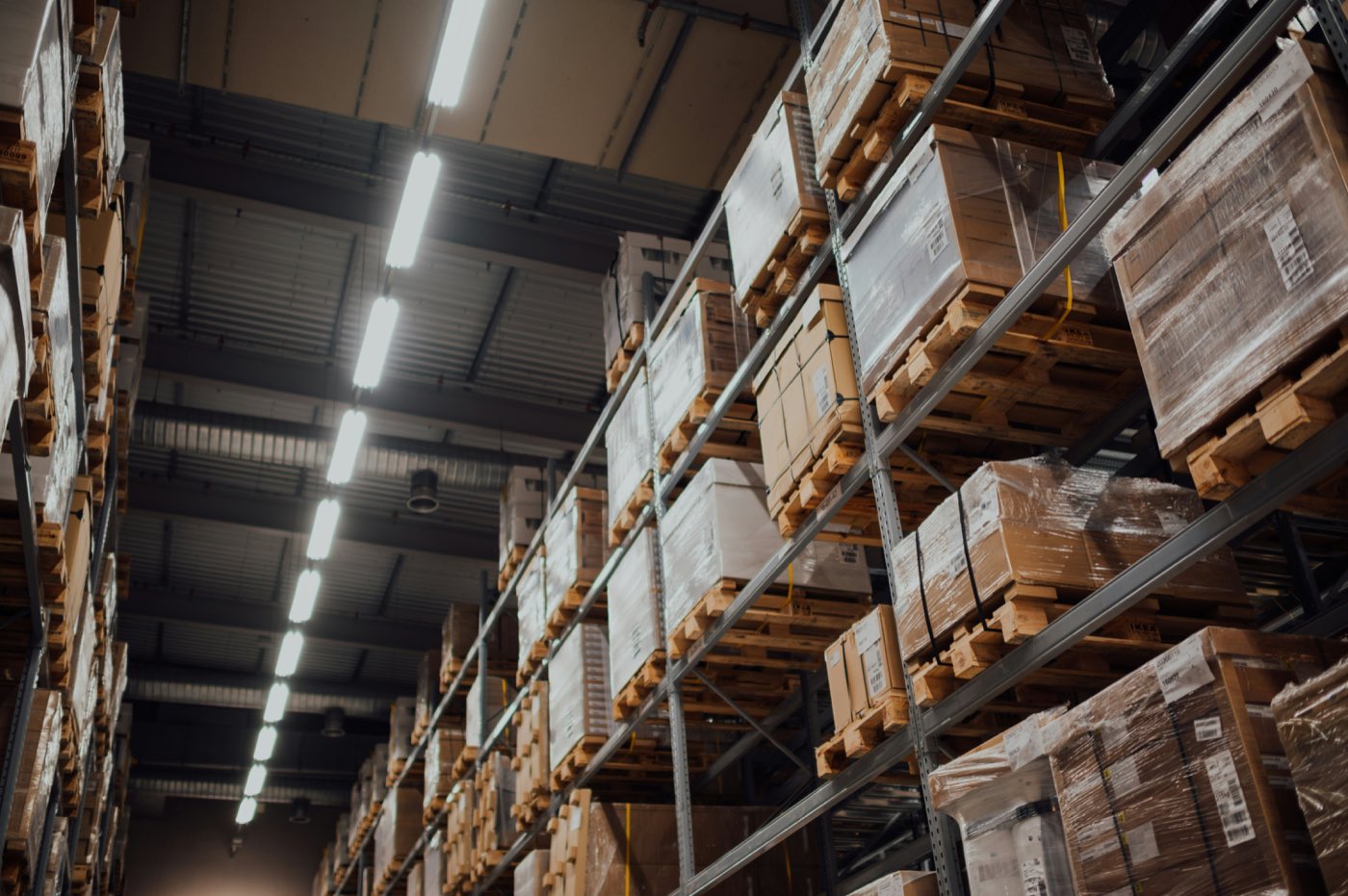 Palletised goods stacked on racking inside a distribution warehouse
